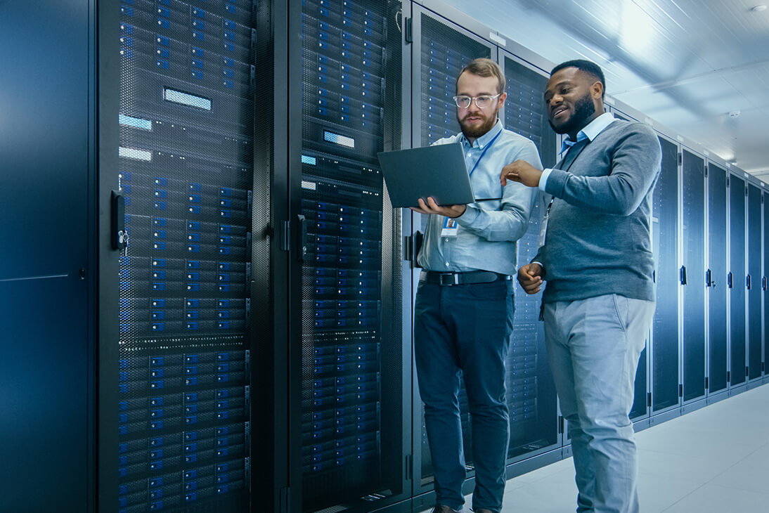 Two people working on the server