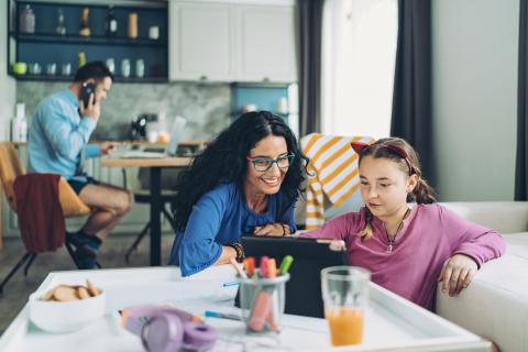 Family using mobile devices in the home